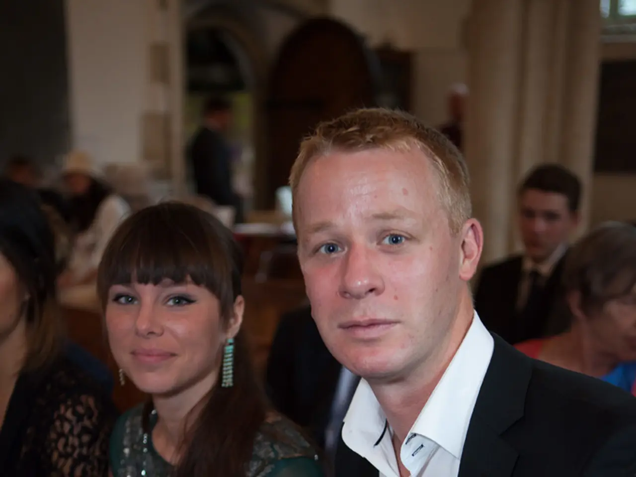 In this image I can see on the right side there is a man, he is wearing black color coat, white...