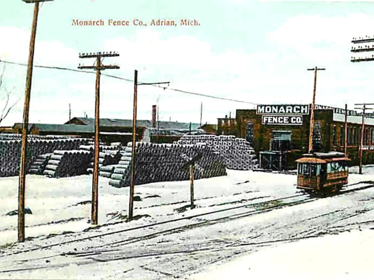 In the image the land is covered with a lot of snow and there is a track and a vehicle is moving on...