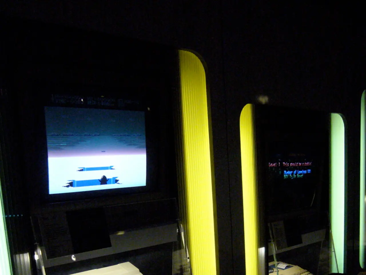 In this image, we can see monitors and joystick along with wires.