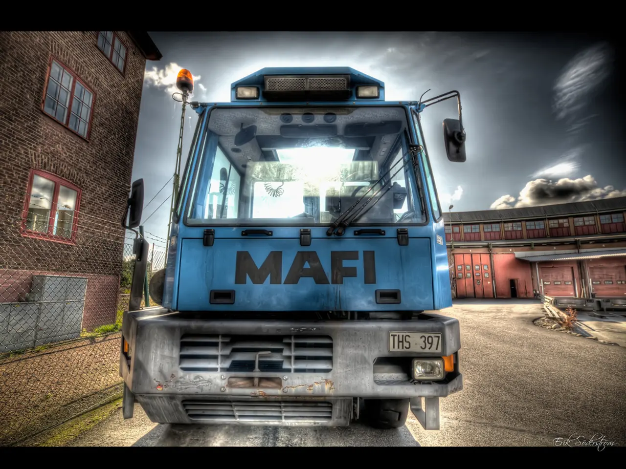 This is an animation picture. There is a bus with a number plate. On the left side there is a...