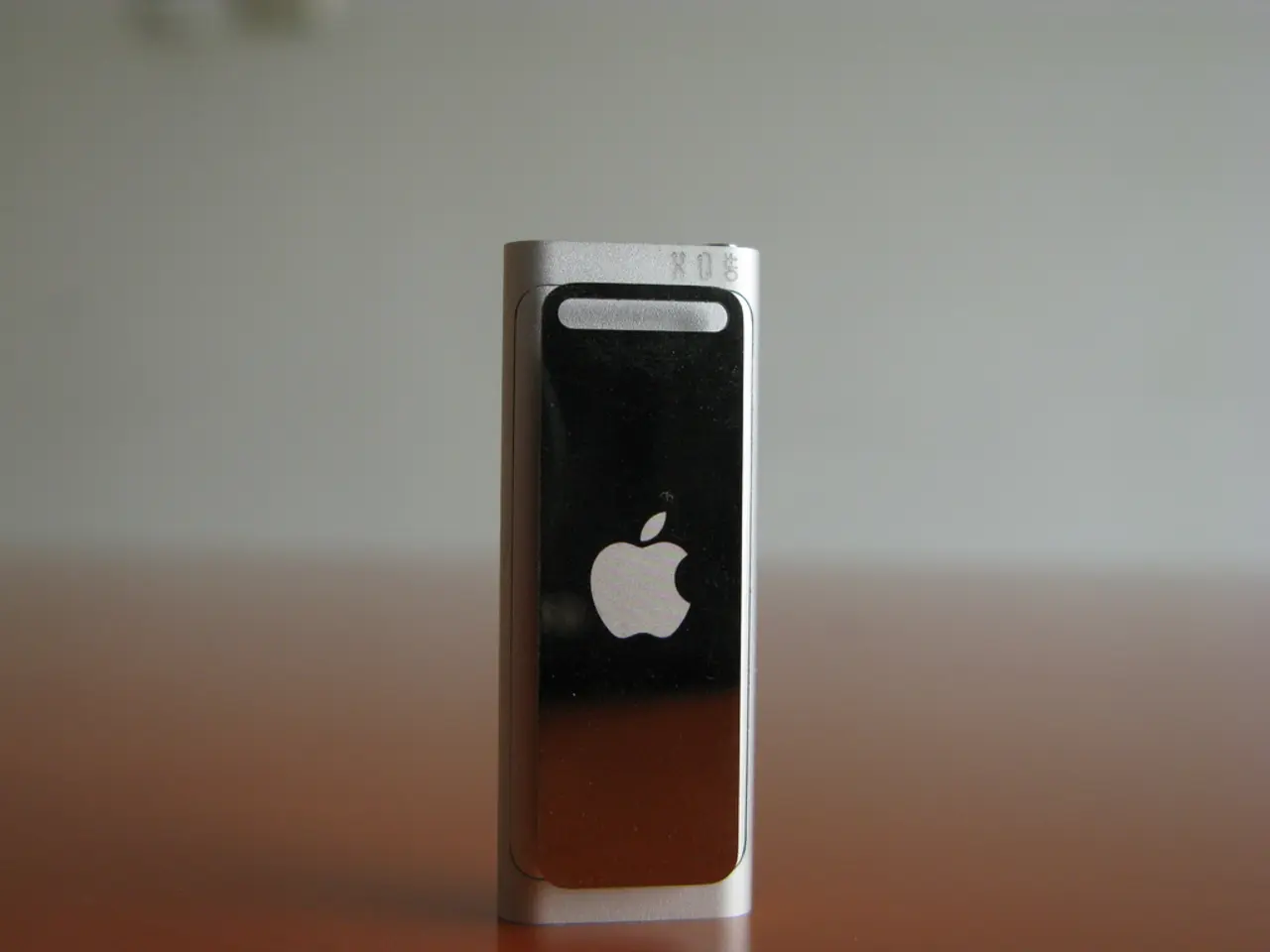 In this image we can see a device with a logo which is placed on the surface.