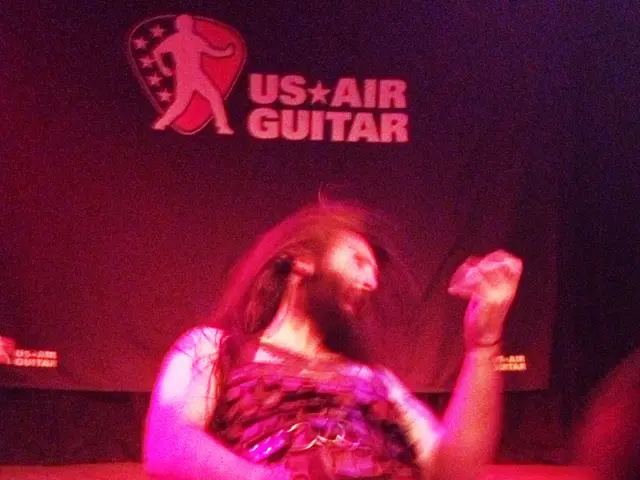 In this image I can see a person wearing a costume. It seems like this person is dancing on the...