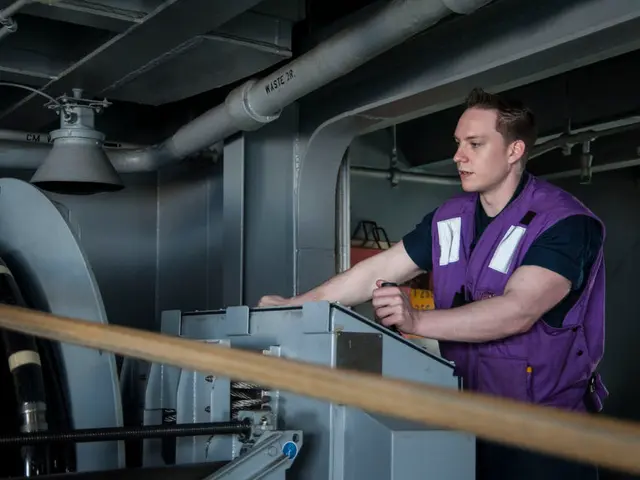 On the right side, there is a person in violet color jacket, standing and operating a machine....