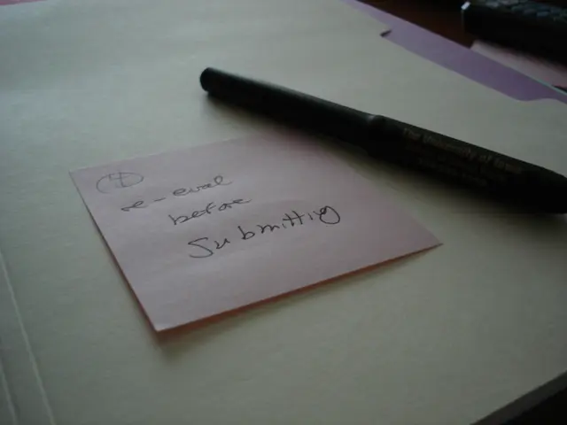 In this image we can see a paper note with some text written on it, and a pen beside it, are placed...