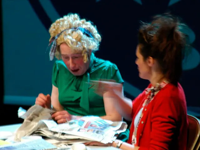 In this image I see 2 women in which this woman is wearing white and red dress and this woman is...