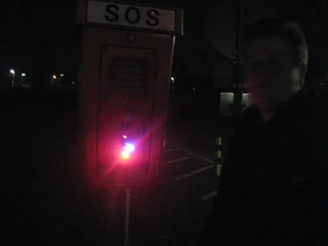 In this image we can see a person standing near SOS equipment which is used for environmental...