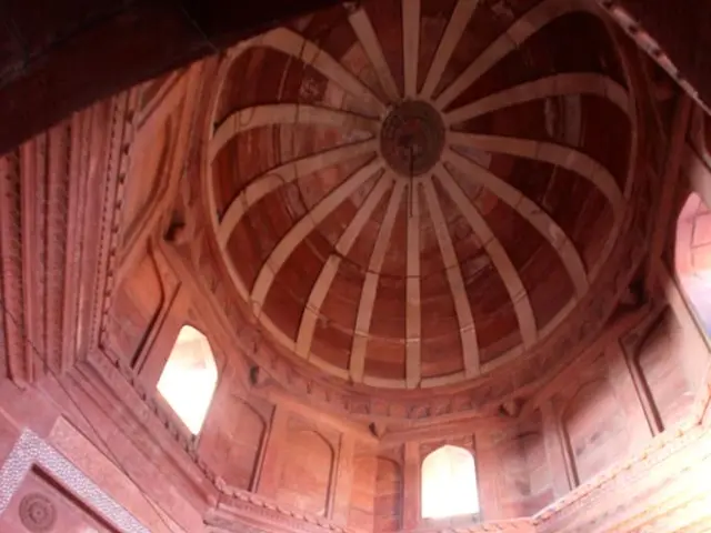 Here in this picture we can see an interior design of a monumental building and in the middle we...